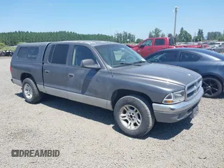 2001 Dodge Dakota Sport z VIN 1B7HL2AN61S311227, wystawiony jako IAAI lot #42366024 z przebiegiem 222 153 mil mil oraz . Historia ofert i sprzedaży dostępna na DreamBid. Obrazek 1.