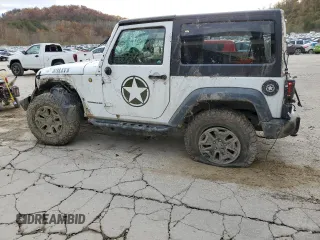 2017 Jeep Wrangler Willys Wheeler with VIN 1C4AJWAG7HL589574, listed as a Copart auction lot 79006504 with 117,075 mi miles and Salvage Title. Bid and sale history available at DreamBid. Image 2.