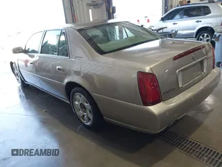 2001 Cadillac DeVille DTS with VIN 1G6KF57911U263913, listed as a IAAI auction lot 41744490 with 100,235 mi miles. Bid and sale history available at carsss.com. Image 3.