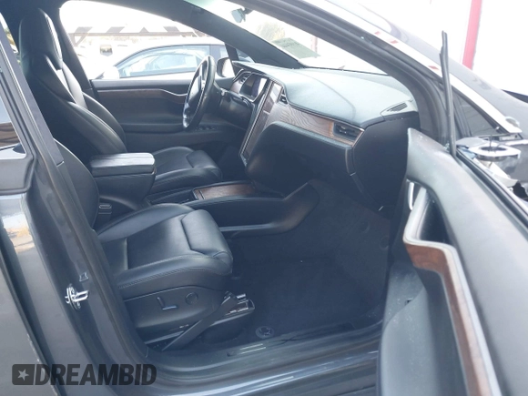 2018 Tesla Model X 75D with VIN 5YJXCDE28JF142509, listed as a IAAI auction lot 41993444 with 100,244 mi miles and . Bid and sale history available at carsss.com. Image 5.