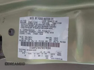 2007 Ford Focus S z VIN 1FAHP37N47W278284, wystawiony jako IAAI lot #42246383 z przebiegiem 164 830 mil mil oraz . Historia ofert i sprzedaży dostępna na DreamBid. Obrazek 9.