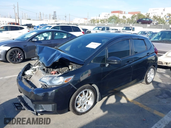 2015 Honda Fit LX z VIN 3HGGK5H57FM717203, wystawiony jako IAAI lot #41615075 z przebiegiem 99 933 mil mil oraz . Historia ofert i sprzedaży dostępna na DreamBid. Obrazek 2.
