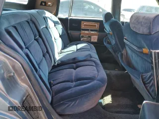 1985 Cadillac Fleetwood z VIN 1G6DW6985F9757401, wystawiony jako Copart lot #59345225 z przebiegiem 91 923 mil mil oraz Tytuł czysty. Historia ofert i sprzedaży dostępna na DreamBid. Obrazek 10.