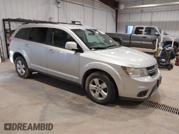 2012 Dodge Journey SXT z VIN 3C4PDDBGXCT257498, wystawiony jako IAAI lot #41746098 z przebiegiem 197 796 mil mil oraz . Historia ofert i sprzedaży dostępna na DreamBid. Obrazek 1.