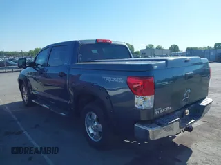 2010 Toyota Tundra with VIN 5TFEY5F11AX097360, listed as a IAAI auction lot 41990256 with 350,830 mi miles and . Bid and sale history available at DreamBid. Image 14.