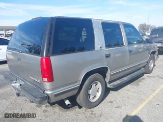 1999 Chevrolet Tahoe with VIN 1GNEC13R8XJ527499, listed as a IAAI auction lot 41880157 with 186,342 mi miles. Bid and sale history available at carsss.com. Image 4.