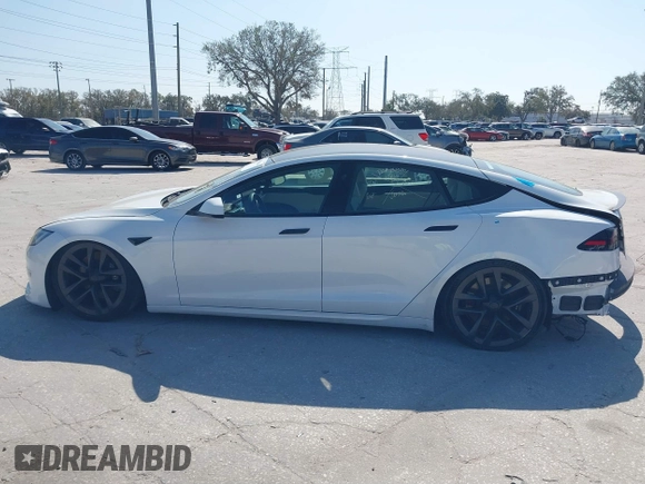 2022 Tesla Model S Plaid with VIN 5YJSA1E64NF484904, listed as a IAAI auction lot 41594464 with 25,299 mi miles and . Bid and sale history available at DreamBid. Image 13.