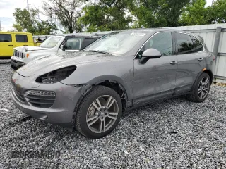2011 Porsche Cayenne S with VIN WP1AB2A2XBLA55565, listed as a Copart auction lot 63094305 with 105,250 mi miles and Salvage title. Bid and sale history available at DreamBid. Image 1.