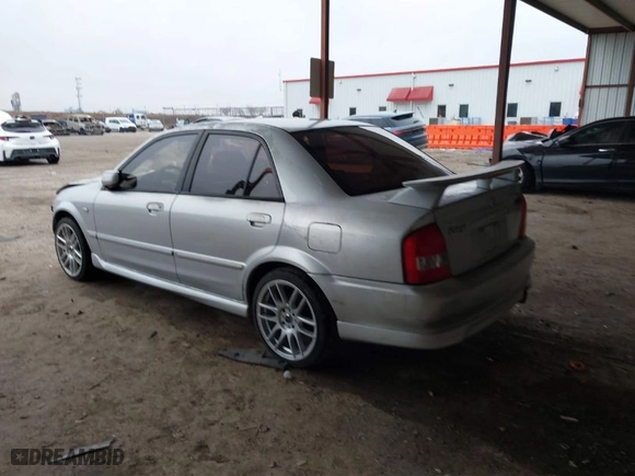 2003 Mazda Protege DX with VIN JM1BJ225030124381, listed as a IAAI auction lot 41607937 with 141,484 mi miles. Bid and sale history available at carsss.com. Image 3.
