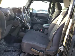 2013 Jeep Wrangler Unlimited Freedom z VIN 1C4BJWDG0DL513902, wystawiony jako Copart lot #52045975 z przebiegiem 166 827 mil mil oraz Szkoda całkowita • Salvage title. Historia ofert i sprzedaży dostępna na DreamBid. Obrazek 7.