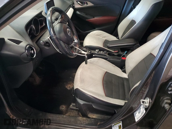 2016 Mazda CX-3 Grand Touring z VIN JM1DKFD74G0137815, wystawiony jako Copart lot #52405765 z przebiegiem 128 922 mil mil oraz Szkoda całkowita • Salvage title. Historia ofert i sprzedaży dostępna na DreamBid. Obrazek 7.