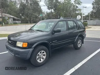 1999 Isuzu Rodeo S z VIN 4S2CK58W7X4357230, wystawiony jako Copart lot #45724855 z przebiegiem 130 446 mil mil oraz Czysty tytuł • Clean title. Historia ofert i sprzedaży dostępna na DreamBid. Obrazek 2.