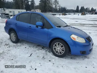 2012 Suzuki SX4 LE with VIN JS2YC5A30C6305375, listed as a Copart auction lot 45429185 with 103,283 mi miles and Salvage Title. Bid and sale history available at DreamBid. Image 4.
