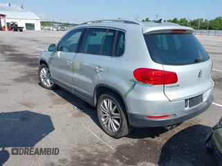 2012 Volkswagen Tiguan SE with VIN WVGAV7AX9CW581957, listed as a IAAI auction lot 42407148 with 135,553 mi miles and . Bid and sale history available at DreamBid. Image 3.