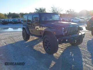 2015 Jeep Wrangler Unlimited Rubicon with VIN 1C4BJWFGXFL610153, listed as a IAAI auction lot 41575401 with 114,583 mi miles. Bid and sale history available at carsss.com. Image 1.