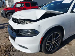 2019 Dodge Charger SXT with VIN 2C3CDXJGXKH533322, listed as a IAAI auction lot 41808838 with 95,877 mi miles and . Bid and sale history available at DreamBid. Image 6.