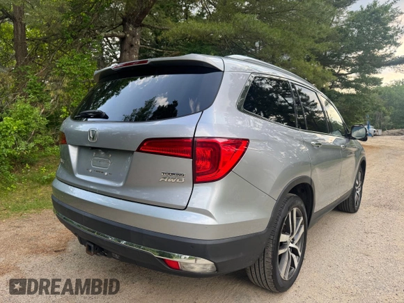 2018 Honda Pilot Touring z VIN 5FNYF6H94JB070661, wystawiony jako Copart lot #60926415 z przebiegiem 205 538 mil mil oraz Czysty tytuł • Clean title. Historia ofert i sprzedaży dostępna na DreamBid. Obrazek 4.