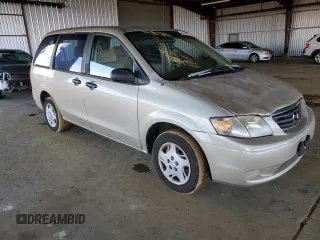 2000 Mazda MPV DX with VIN JM3LW28G8Y0142883, listed as a Copart auction lot 82633154 with 161,196 mi miles and Salvage title. Bid and sale history available at DreamBid. Image 4.