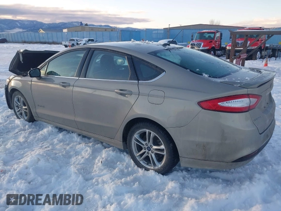 2016 Ford Fusion SE Hybrid with VIN 3FA6P0LU8GR127311, listed as a IAAI auction lot 41242945 with 1 mi miles. Bid and sale history available at carsss.com. Image 3.