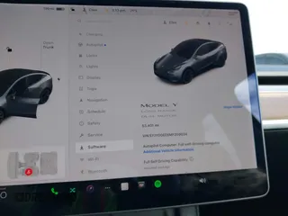 2021 Tesla Model Y Long Range with VIN 5YJYGDEE6MF209034, listed as a IAAI auction lot 41896238 with 53,401 mi miles. Bid and sale history available at carsss.com. Image 7.