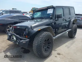 2012 Jeep Wrangler Unlimited Sport with VIN 1C4BJWDG3CL200826, listed as a IAAI auction lot 42261113 with 135,554 mi miles and . Bid and sale history available at DreamBid. Image 18.