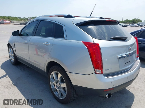 2011 Cadillac SRX Premium Collection with VIN 3GYFNCEY2BS594415, listed as a IAAI auction lot 42042854 with 130,894 mi miles and . Bid and sale history available at DreamBid. Image 3.
