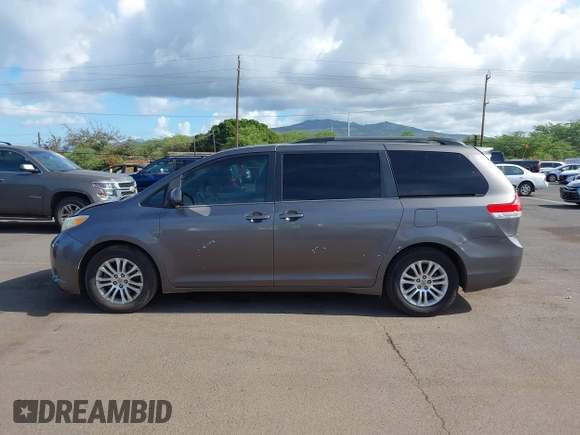 2014 Toyota Sienna XLE with VIN 5TDYK3DC2ES438980, listed as a IAAI auction lot 42067750 with 143,728 mi miles and . Bid and sale history available at DreamBid. Image 14.