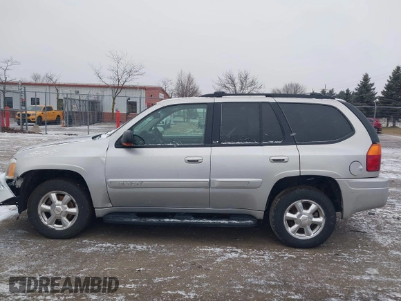 2005 GMC Envoy SLT with VIN 1GKDT13S352258640, listed as a IAAI auction lot 41226997 with 159,665 mi miles. Bid and sale history available at carsss.com. Image 14.