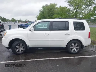 2013 Honda Pilot Touring with VIN 5FNYF4H96DB016044, listed as a IAAI auction lot 42314590 with 183,913 mi miles and . Bid and sale history available at DreamBid. Image 14.