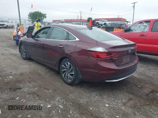2020 Honda Insight Touring z VIN 19XZE4F93LE010040, wystawiony jako IAAI lot #42240572 z przebiegiem 52 299 mil mil oraz . Historia ofert i sprzedaży dostępna na DreamBid. Obrazek 3.