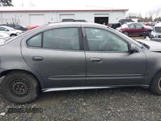 2004 Pontiac Grand Am SE with VIN 1G2NE52F94M530881, listed as a IAAI auction lot 41648302 with 116,540 mi miles. Bid and sale history available at carsss.com. Image 14.