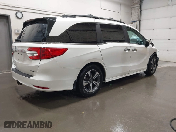 2019 Honda Odyssey Touring with VIN 5FNRL6H8XKB079113, listed as a IAAI auction lot 42359455 with 74,545 mi miles and . Bid and sale history available at DreamBid. Image 4.