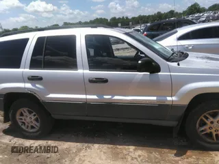 2004 Jeep Grand Cherokee Laredo z VIN 1J4GW48SX4C309998, wystawiony jako IAAI lot #42307167 z przebiegiem 306 912 mil mil oraz . Historia ofert i sprzedaży dostępna na DreamBid. Obrazek 13.