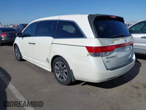 2014 Honda Odyssey Touring with VIN 5FNRL5H97EB037361, listed as a IAAI auction lot 42106742 with 198,279 mi miles and . Bid and sale history available at DreamBid. Image 3.