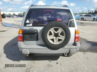 2003 Chevrolet Tracker with VIN 2CNBE13C836953178, listed as a Copart auction lot 60715605 with 128,978 mi miles and Salvage title. Bid and sale history available at DreamBid. Image 6.
