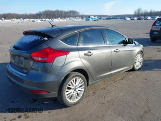 2015 Ford Focus Titanium z VIN 1FADP3N23FL368324, wystawiony jako IAAI lot #41387070 z przebiegiem Nie podano mil oraz . Historia ofert i sprzedaży dostępna na DreamBid. Obrazek 4.