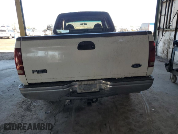 1998 Ford F-150 with VIN 1FTDX176XWNA06879, listed as a Copart auction lot 46032145 with 211,308 mi miles and Salvage title. Bid and sale history available at DreamBid. Image 6.