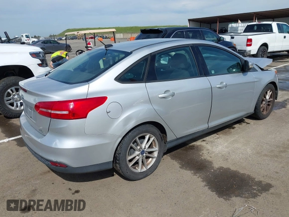 2015 Ford Focus SE with VIN 1FADP3F24FL203509, listed as a IAAI auction lot 41765582 with 139,856 mi miles. Bid and sale history available at carsss.com. Image 4.