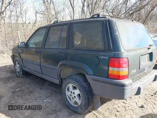 1993 Jeep Grand Cherokee Laredo with VIN 1J4GZ58S1PC680016, listed as a IAAI auction lot 41813392 with 149,520 mi miles. Bid and sale history available at carsss.com. Image 3.