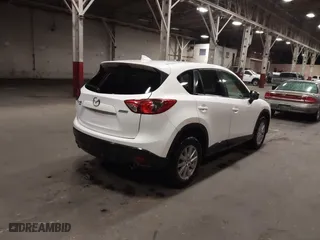 2016 Mazda CX-5 Touring with VIN JM3KE4CY0G0853261, listed as a IAAI auction lot 41861176 with 63,491 mi miles. Bid and sale history available at carsss.com. Image 4.