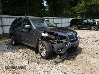 2012 BMW X5 35i z VIN 5UXZV4C55CL753810, wystawiony jako Copart lot #62405565 z przebiegiem 178 504 mil mil oraz Szkoda całkowita • Salvage title. Historia ofert i sprzedaży dostępna na DreamBid. Obrazek 14.