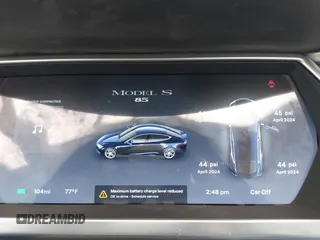2013 Tesla Model S with VIN 5YJSA1CNXDFP06077, listed as a IAAI auction lot 41958105 with 84,773 mi miles. Bid and sale history available at carsss.com. Image 7.