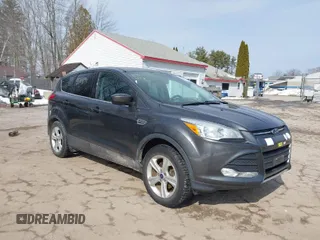 2015 Ford Escape SE with VIN 1FMCU0GXXFUB99852, listed as a IAAI auction lot 41704198 with 84,735 mi miles. Bid and sale history available at carsss.com. Image 1.