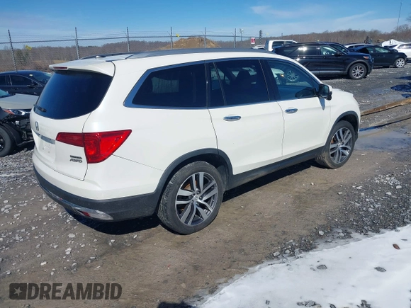 2017 Honda Pilot Touring with VIN 5FNYF6H95HB094641, listed as a IAAI auction lot 41531652 with 97,615 mi miles. Bid and sale history available at carsss.com. Image 4.
