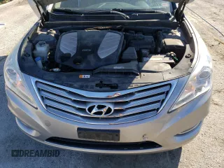 2013 Hyundai Azera с VIN KMHFG4JG8DA256908, выставлен на аукционе Copart как лот 50573915 с пробегом 146 015 миль миль и Списание • Salvage title. История ставок и продаж доступна на DreamBid. Изображение 11.