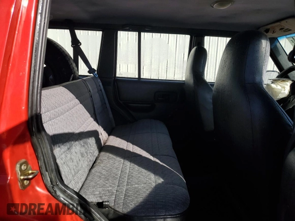 1999 Jeep Cherokee SE with VIN 1J4FT28S6XL515896, listed as a Copart auction lot 83745444 with 192,406 mi miles and Salvage title. Bid and sale history available at DreamBid. Image 11.
