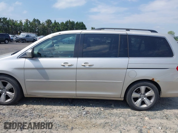 2006 Honda Odyssey Touring z VIN 5FNRL38816B012601, wystawiony jako IAAI lot #42148571 z przebiegiem 278 590 mil mil oraz . Historia ofert i sprzedaży dostępna na DreamBid. Obrazek 14.
