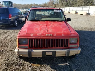 1993 Jeep Cherokee z VIN 1J4FT78S9PL634409, wystawiony jako Copart lot #77034984 z przebiegiem 146 585 mil mil oraz Szkoda całkowita • Salvage title. Historia ofert i sprzedaży dostępna na DreamBid. Obrazek 5.