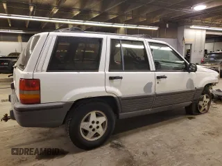 1993 Jeep Grand Cherokee Laredo with VIN 1J4GZ58SXPC554642, listed as a Copart auction lot 83268254 with 266,063 mi miles and Salvage Title. Bid and sale history available at carsss.com. Image 3.