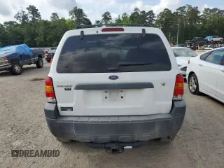 2006 Ford Escape XLT with VIN 1FMYU03146KC34615, listed as a Copart auction lot 55096195 with 144,398 mi miles and Salvage Title. Bid and sale history available at DreamBid. Image 6.